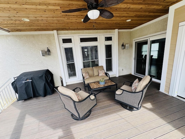 wooden terrace featuring ceiling fan, grilling area, and outdoor lounge area