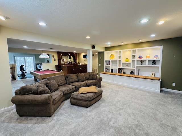 carpeted living room with a bar, recessed lighting, a textured ceiling, and pool table