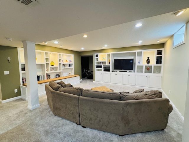 carpeted living area with baseboards, recessed lighting, built in shelves, and visible vents