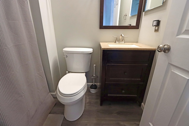 full bath with vanity, toilet, wood finished floors, and a shower with shower curtain