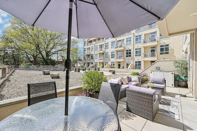 view of patio / terrace featuring outdoor dining space and an outdoor living space
