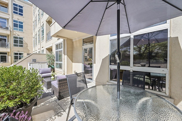 view of patio featuring outdoor dining area and an outdoor living space