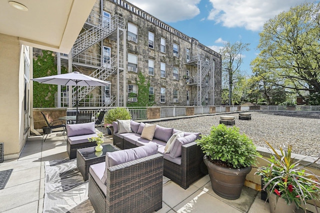 view of patio / terrace featuring an outdoor hangout area and a fenced backyard