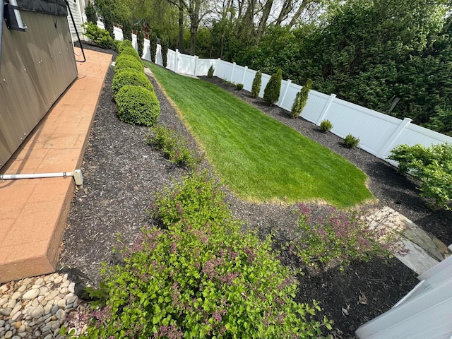 view of yard with a fenced backyard