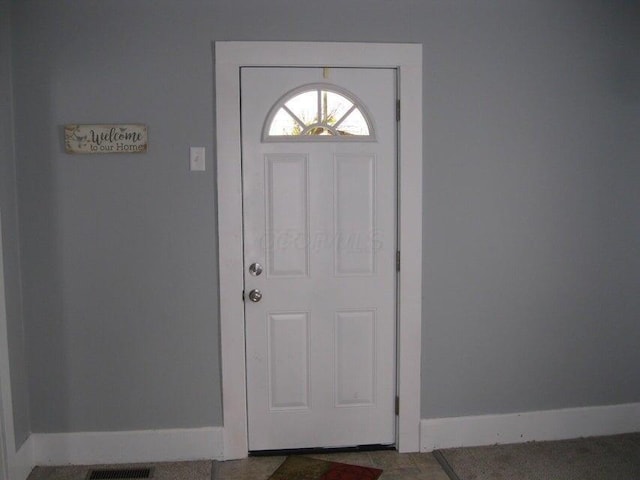 foyer entrance with baseboards