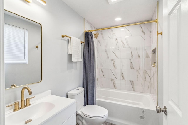 bathroom with toilet, shower / tub combo with curtain, and vanity
