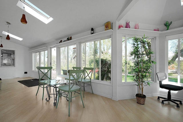 1108 W Church St, Newark, OH 43055 - sunroom / solarium with lofted ceiling, a skylight, wood finished floors, and healthy amount of natural light