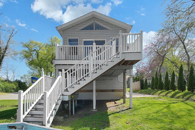 1108 W Church St, Newark, OH 43055 - rear view of house featuring stairway, a yard, and a wooden deck