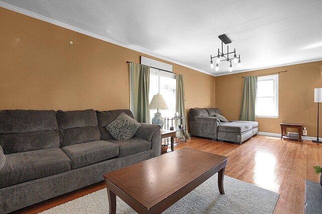 1108 W Church St, Newark, OH 43055 - living area featuring light wood finished floors, crown molding, and baseboards