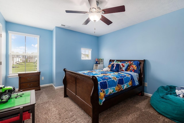 bedroom featuring visible vents, a ceiling fan, carpet, and baseboards