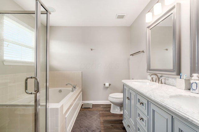 full bathroom featuring visible vents, a garden tub, baseboards, a shower stall, and a sink