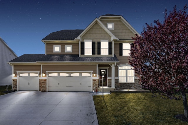 view of front of house featuring driveway, stone siding, and a front lawn
