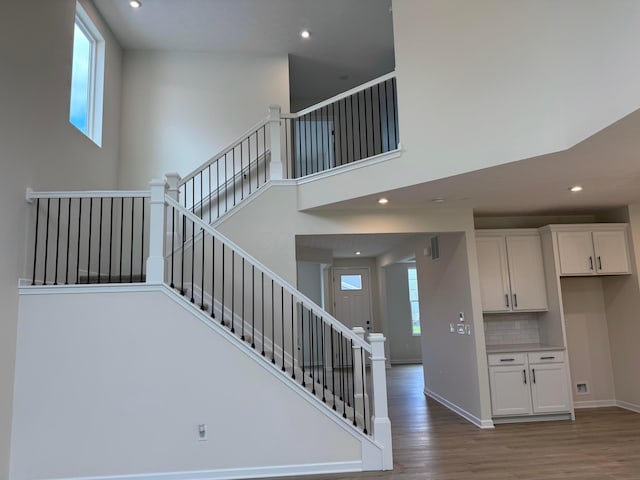 9920 Glenfield Ct Lot 51, Plain City, OH 43064 - staircase with recessed lighting, wood finished floors, and a towering ceiling