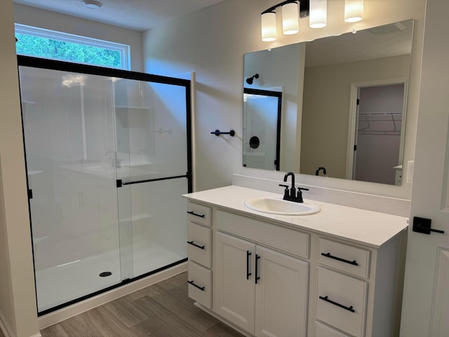 9920 Glenfield Ct Lot 51, Plain City, OH 43064 - full bath featuring a stall shower, wood finished floors, vanity, and a spacious closet