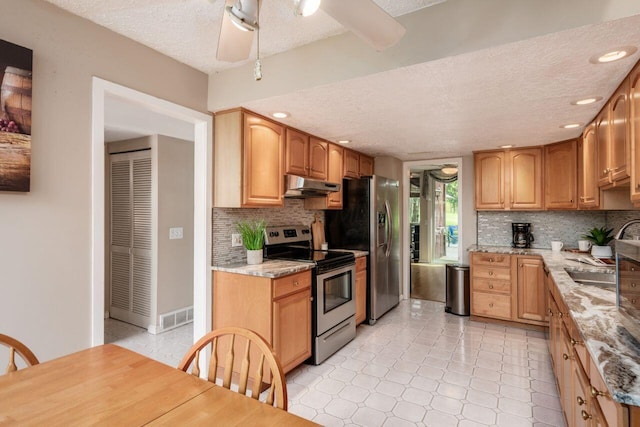4917 Whistlewood Ln Unit 5, Westerville, OH 43081 - kitchen featuring under cabinet range hood, a textured ceiling, stainless steel electric stove, and decorative backsplash
