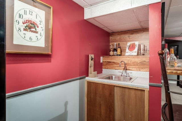 4917 Whistlewood Ln Unit 5, Westerville, OH 43081 - bar with a paneled ceiling, wooden walls, a sink, and indoor wet bar