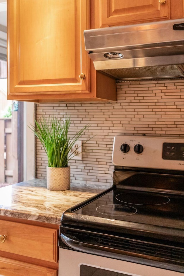 4917 Whistlewood Ln Unit 5, Westerville, OH 43081 - room details with backsplash, stainless steel range with electric cooktop, and extractor fan