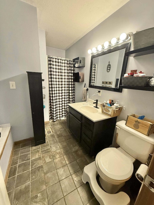 full bath featuring vanity, a textured ceiling, toilet, and a shower with curtain