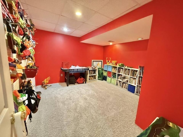 rec room with recessed lighting, carpet, and a drop ceiling