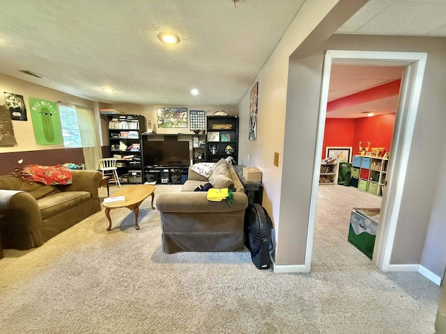 living area featuring visible vents, recessed lighting, carpet, and baseboards
