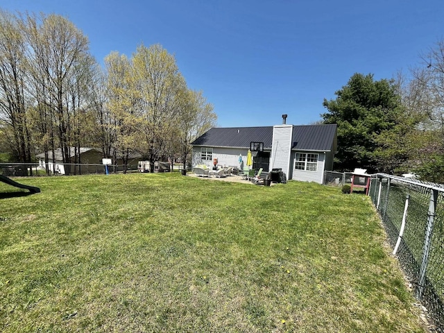 view of yard with a patio and fence
