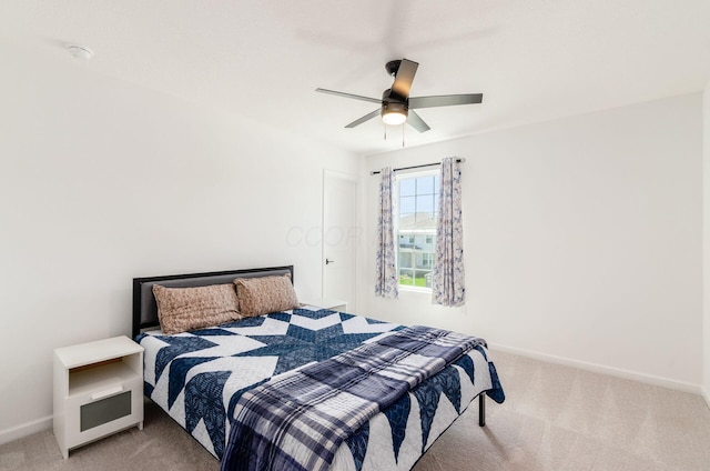 bedroom featuring carpet floors, baseboards, and ceiling fan