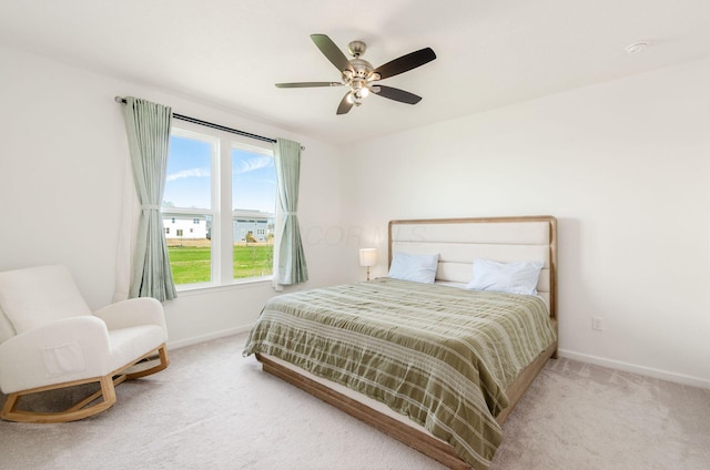 bedroom with baseboards, a ceiling fan, and carpet floors