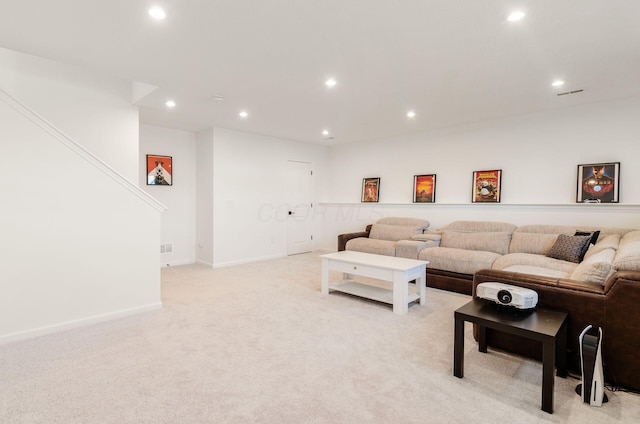living area with recessed lighting, baseboards, and light carpet