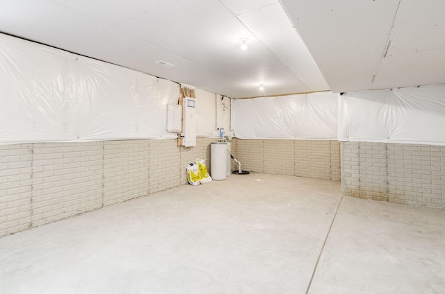unfinished basement with water heater