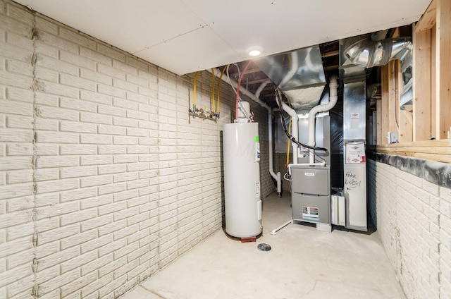 utility room featuring heating unit and water heater