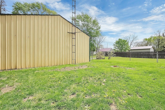 512 Henry St, Marion, OH 43302 - view of yard featuring an outdoor structure, fence, and an outbuilding