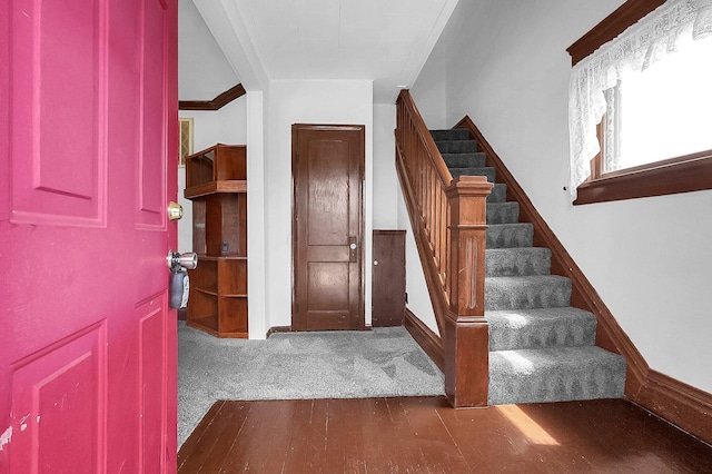 512 Henry St, Marion, OH 43302 - foyer entrance with crown molding, baseboards, stairs, and wood finished floors