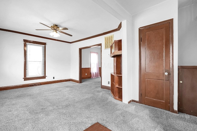512 Henry St, Marion, OH 43302 - carpeted spare room featuring baseboards, ornamental molding, a ceiling fan, and visible vents