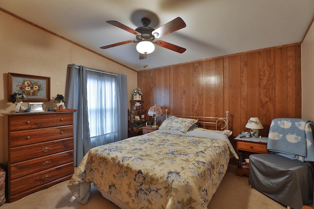 bedroom featuring carpet, ceiling fan, lofted ceiling, and wooden walls