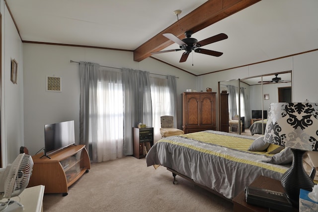 bedroom featuring crown molding, lofted ceiling with beams, carpet, and a ceiling fan