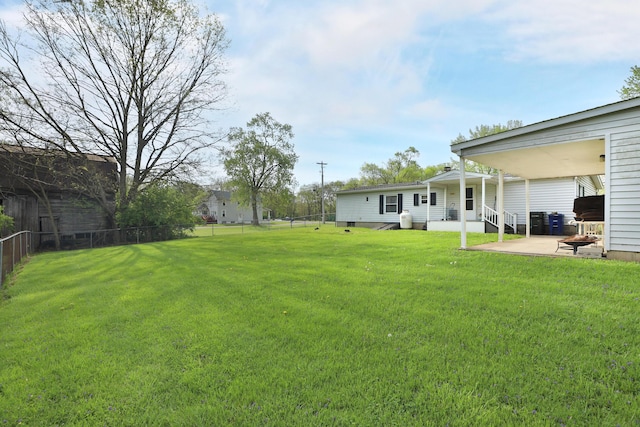 view of yard with a fenced backyard and a patio area