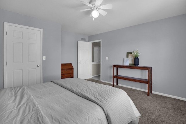 bedroom with baseboards, a ceiling fan, carpet flooring, and visible vents