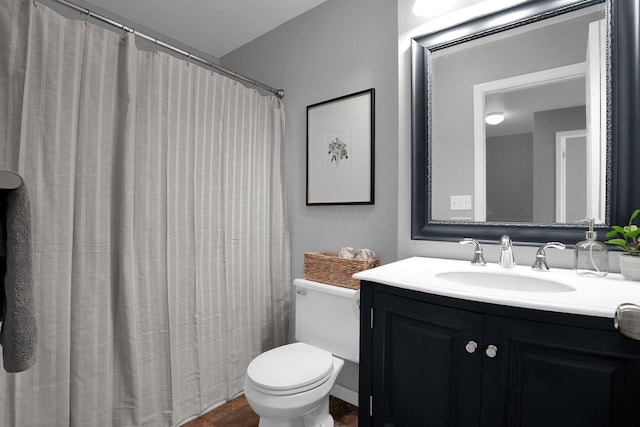 full bath with toilet and vanity