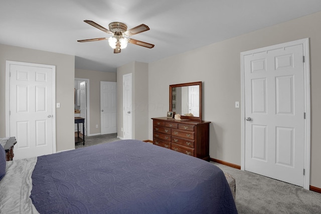 carpeted bedroom with baseboards and ceiling fan
