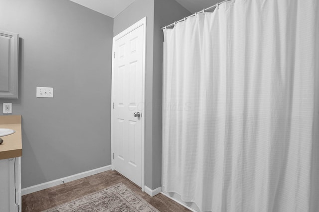 bathroom featuring vanity and baseboards