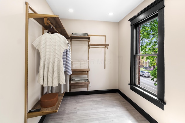 spacious closet featuring wood finished floors