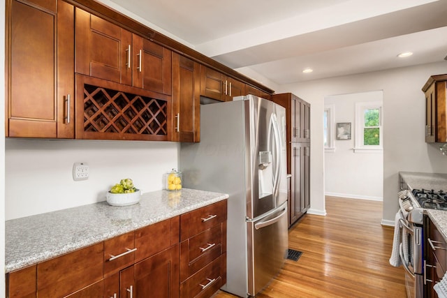 1800 Bryden Rd, Columbus, OH 43205 - kitchen with stainless steel appliances, baseboards, light wood-type flooring, light stone countertops, and recessed lighting