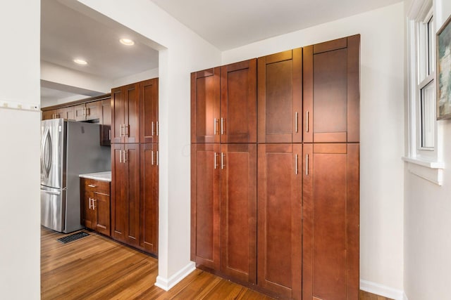 1800 Bryden Rd, Columbus, OH 43205 - kitchen with freestanding refrigerator, wood finished floors, light countertops, baseboards, and recessed lighting