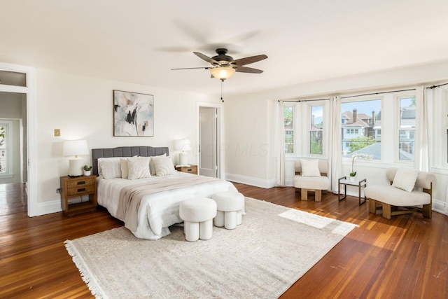 1800 Bryden Rd, Columbus, OH 43205 - bedroom with dark wood-style floors, baseboards, and a ceiling fan