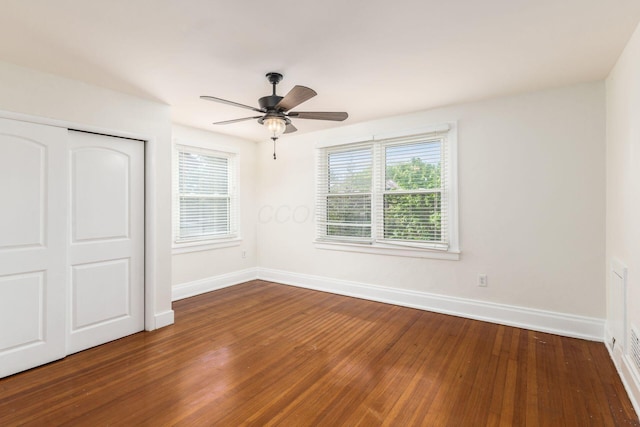 1800 Bryden Rd, Columbus, OH 43205 - unfurnished bedroom featuring wood finished floors, baseboards, a closet, and ceiling fan
