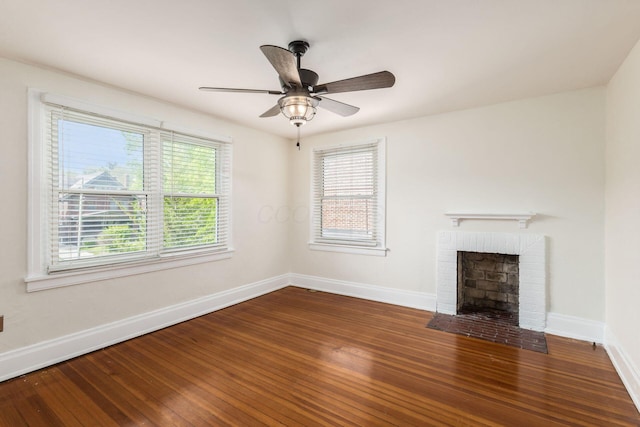 1800 Bryden Rd, Columbus, OH 43205 - unfurnished living room with hardwood / wood-style floors, baseboards, a brick fireplace, and ceiling fan