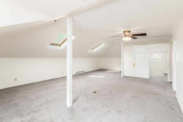 1800 Bryden Rd, Columbus, OH 43205 - additional living space with a ceiling fan, carpet, lofted ceiling, a baseboard heating unit, and a skylight