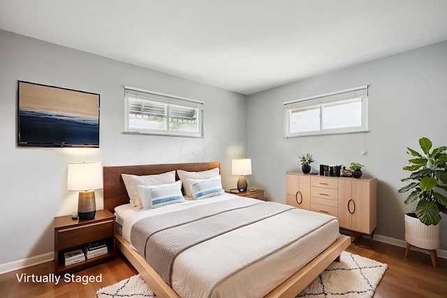 361 E Stafford Ave, Columbus, OH 43085 - bedroom with wood finished floors and baseboards