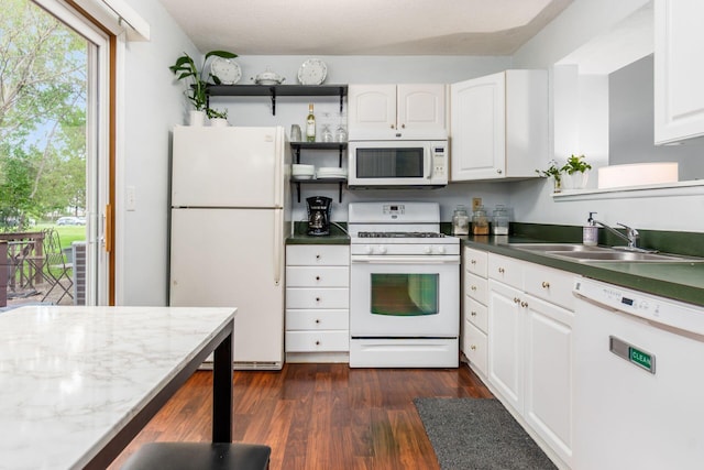 kitchen with open shelves, a sink, white appliances, white cabinetry, and dark wood-type flooring