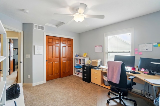 office with visible vents, attic access, baseboards, and light carpet